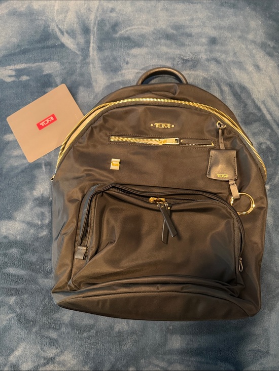 Tumi Handbags - Tumi Black Nylon Backpack with Gold Accents